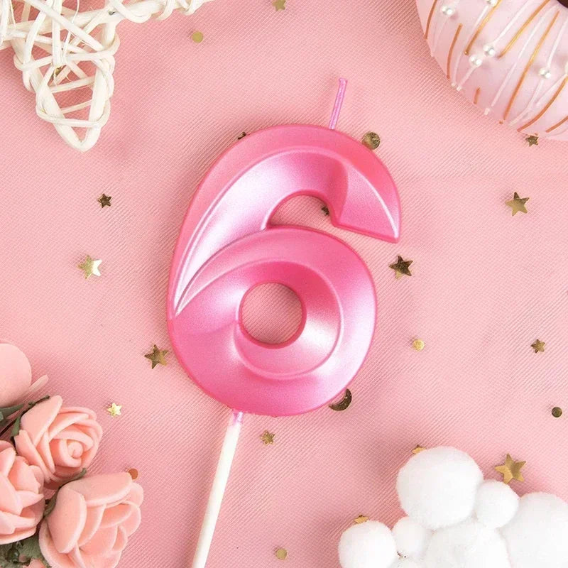 A pink number six candle on a white stick is shown against a pink background with scattered gold stars and pink roses.