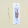 A package of 12 party candles featuring long, thin, spiral-shaped birthday candles.