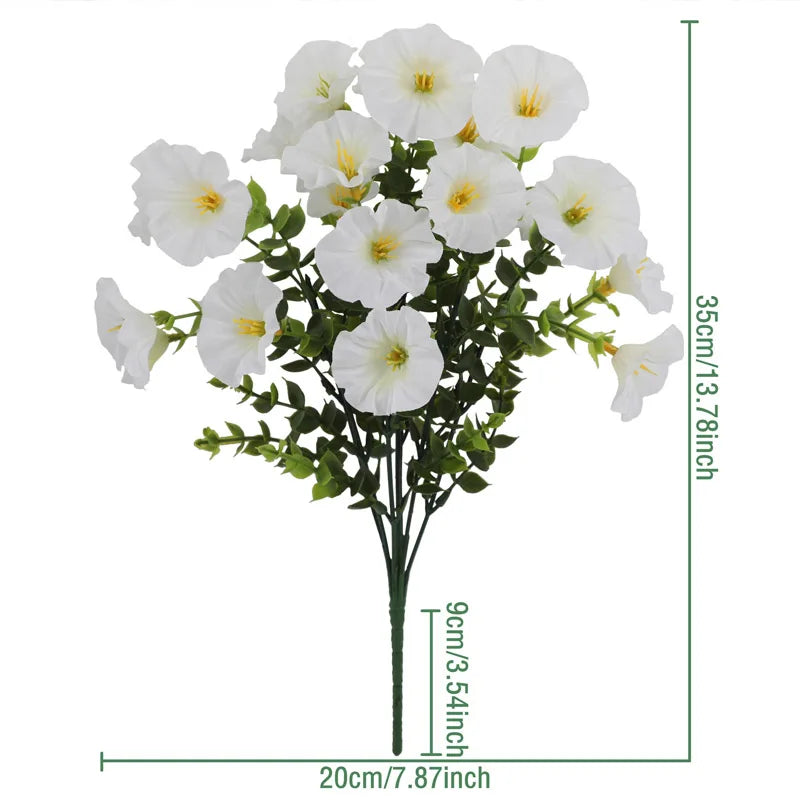 A bouquet of white artificial silk cloth flowers with green leaves.