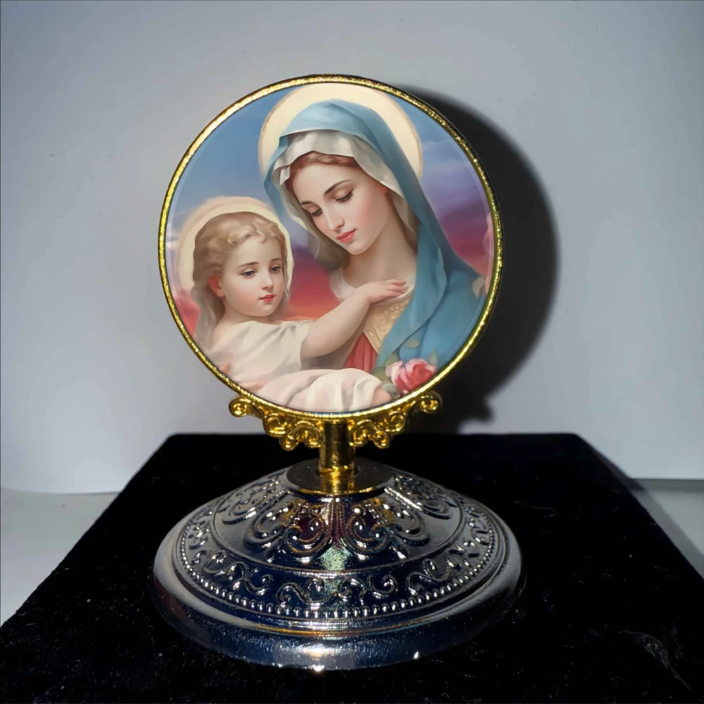 A round religious ornament featuring a depiction of the Virgin Mary and a child, set on a gold-toned base.