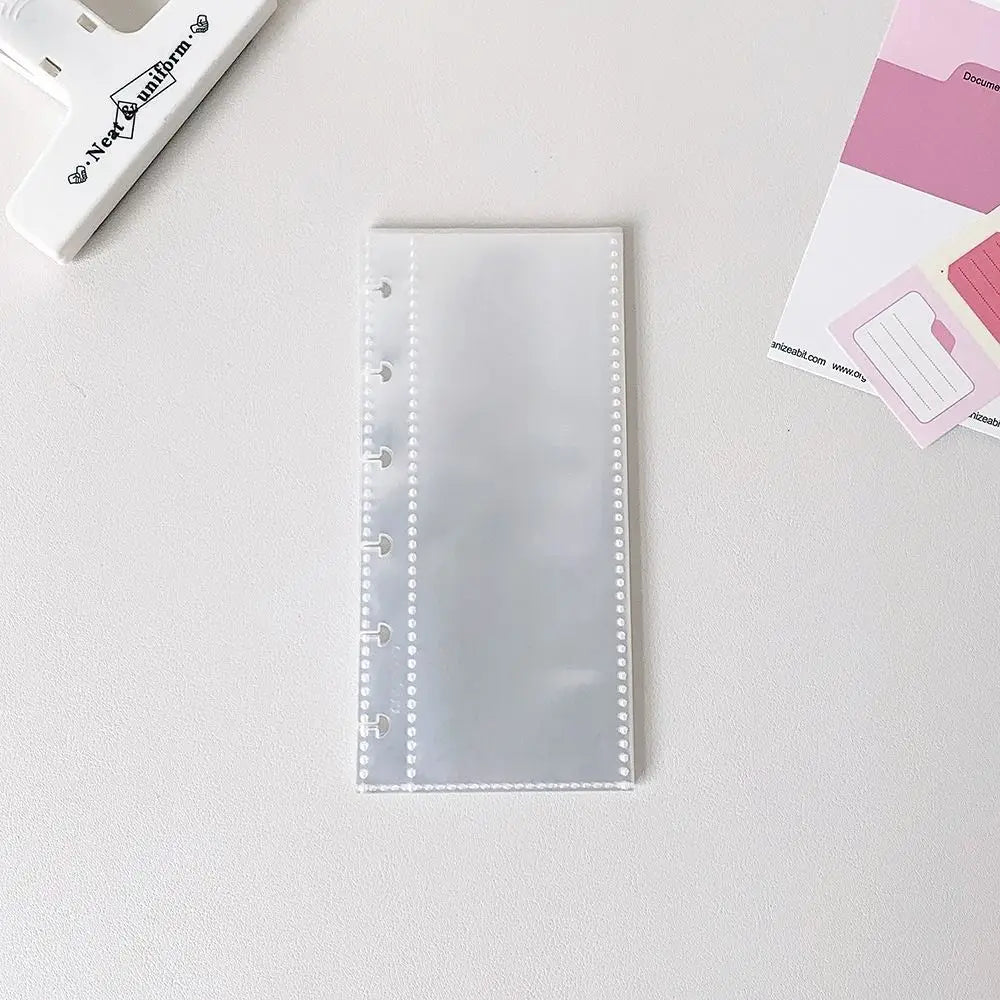 A transparent photocard album with a clear plastic cover featuring a mushroom hole design.