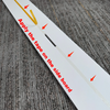 A white sign with red arrows instructs to apply tape on the side board for a light-up marquee number sign.