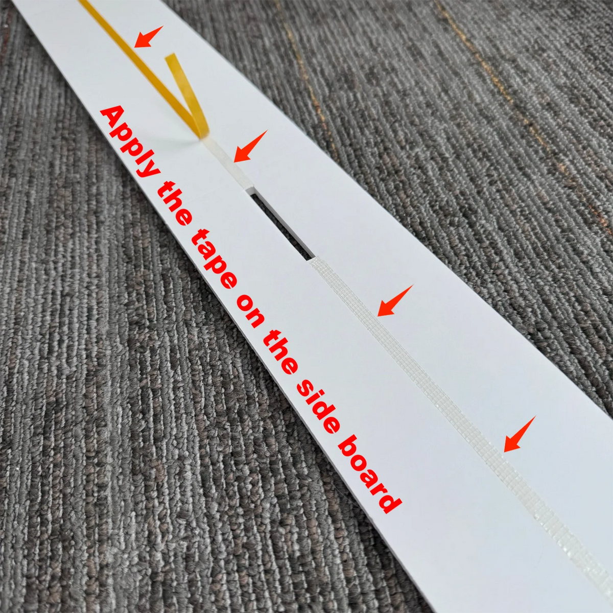 A white sign with red arrows instructs to apply tape on the side board for a light-up marquee number sign.