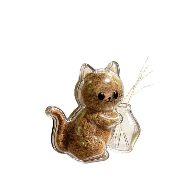 A small, clear capsule shaped like a cat with whiskers, used as a keepsake magnet.