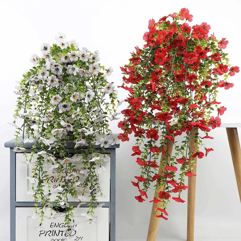 Artificial morning glory hanging flowers in red and white on a wooden stand