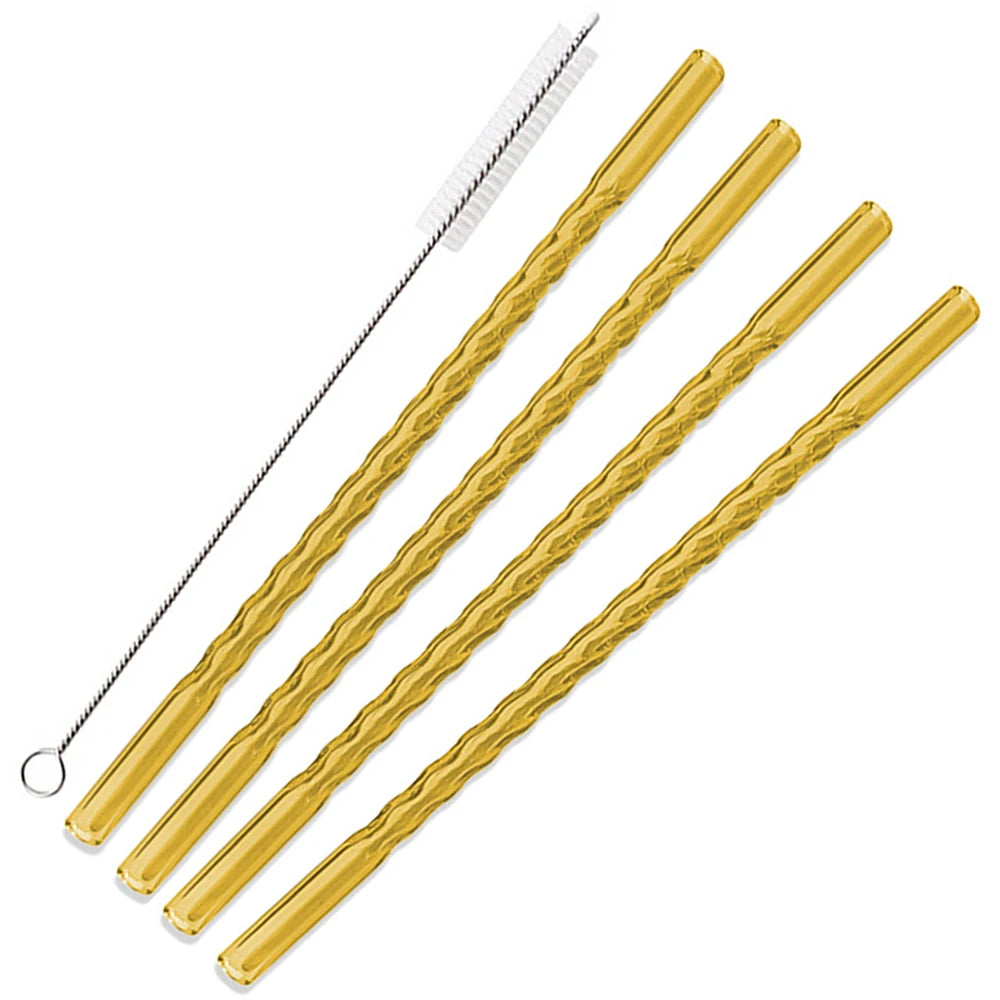 A set of gold-colored reusable borosilicate glass straws with cleaning brushes.