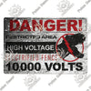 A vintage metal warning sign with red text and black background displaying DANGER, restricted area, high voltage, and 10,000 