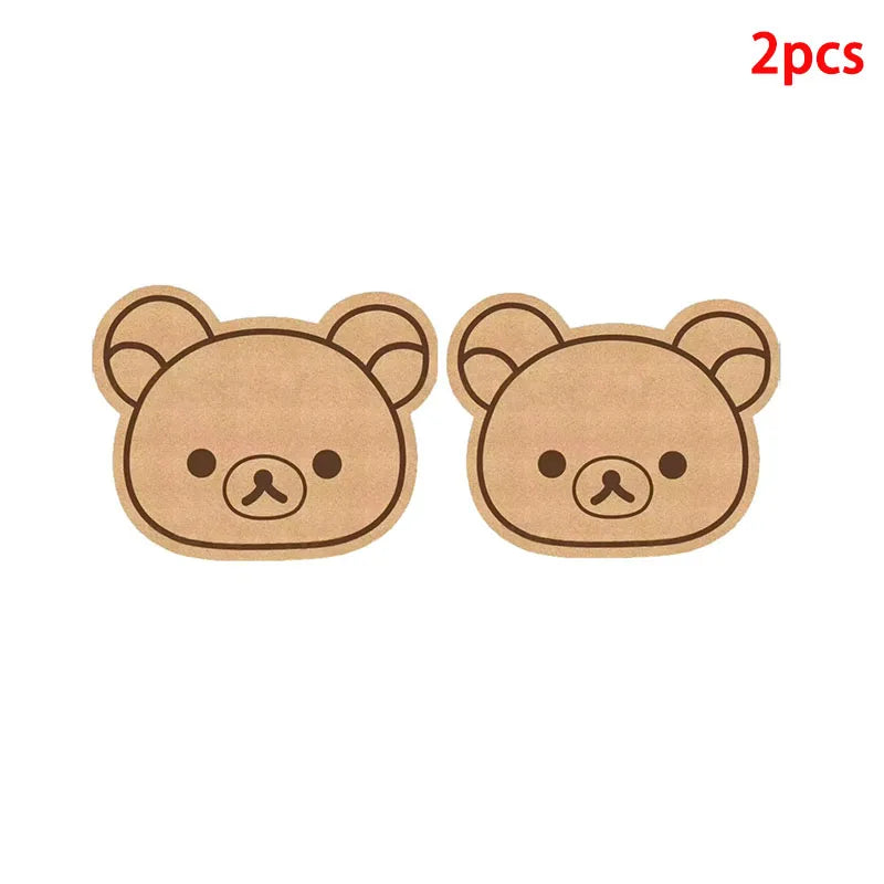 A pair of light brown felt cartoon bear face wall decor panels for children's rooms.