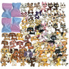A collection of mini figures featuring dogs and cats in various colors and styles.
