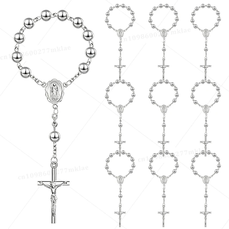 A collection of mini baptism rosary favors featuring various cross styles and designs.