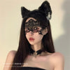 A woman models an elegant black lace masquerade eye mask and a black feathered hair accessory.