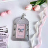 Silver lace PU card holder with a butterfly charm and pink ribbon bow keychain