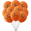 A bunch of orange latex balloons shaped like construction tractors and excavators with happy birthday text