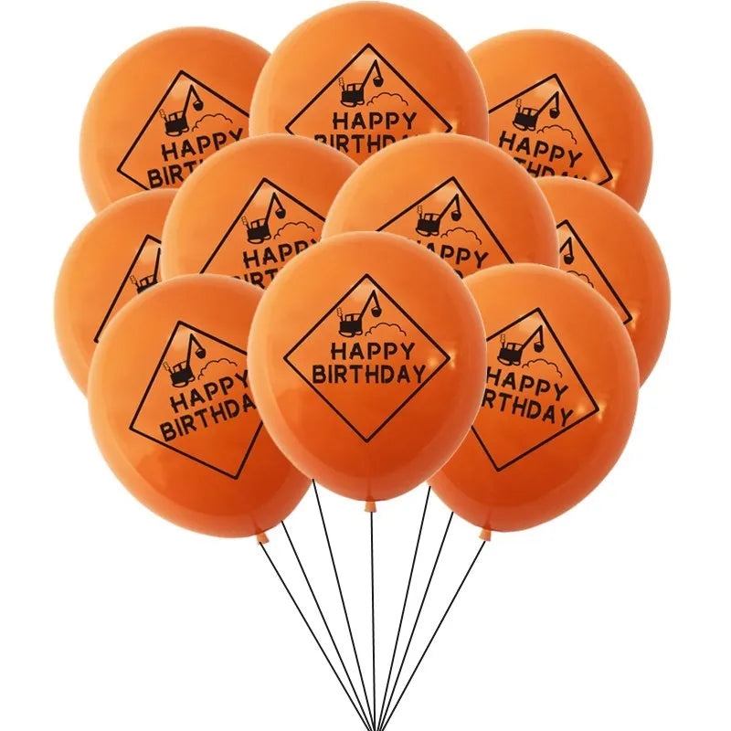 A bunch of orange latex balloons shaped like construction tractors and excavators with happy birthday text