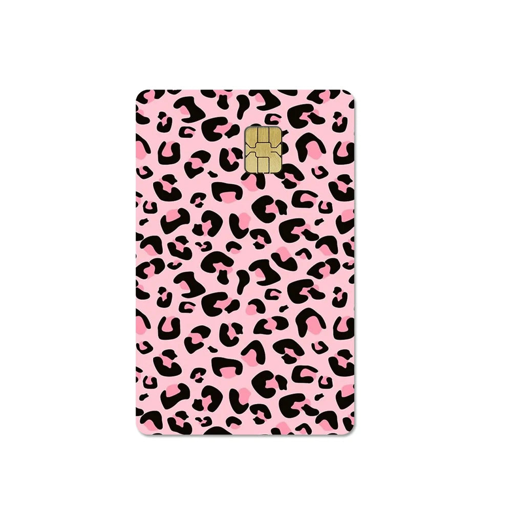 A pink card cover featuring a leopard print pattern with a gold embossed design.