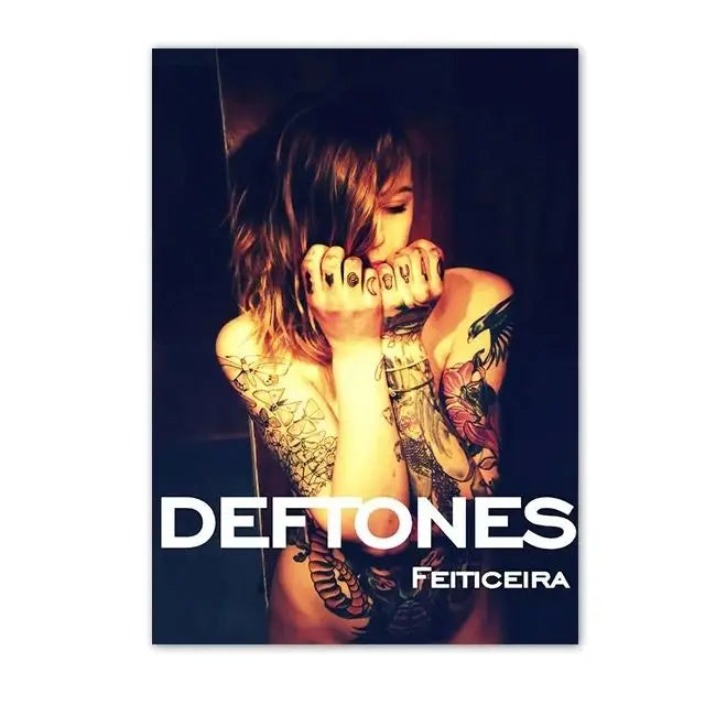 A dark, moody photograph of a person with long hair and tattoos, likely featuring the Deftones band.