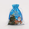 A set of five festive blue drawstring Christmas gift bags featuring Santa and snowman designs.