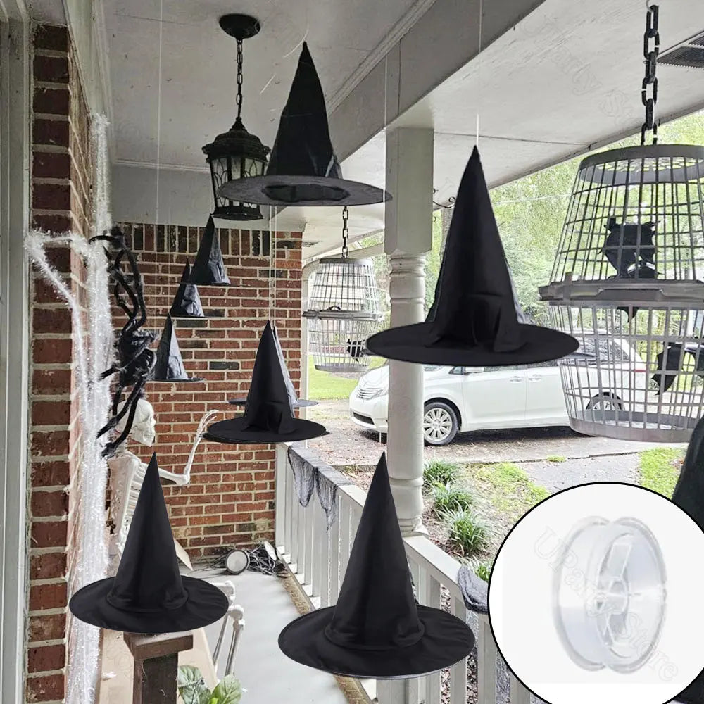 Classic black witch hats with hanging rope used as Halloween décor displayed outdoors.