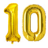 A large, shiny gold foil balloon shaped like the number 10.