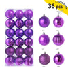 A set of 24 festive purple and pink Christmas baubles for holiday tree and decor.