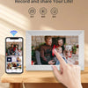 A white digital photo frame displaying a family, next to a smartphone showing a recording interface.