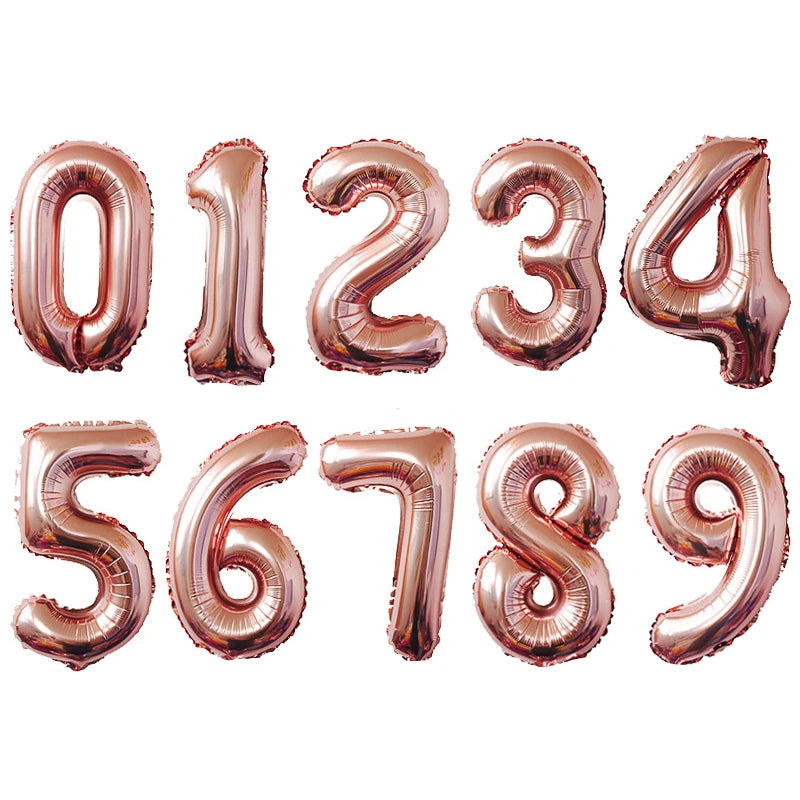 A set of rose gold and silver gradient foil balloons forming the numbers 0 through 9.