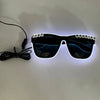 A pair of black sunglasses with blue LED lights around the frame and lenses, connected by an EL wire cable.