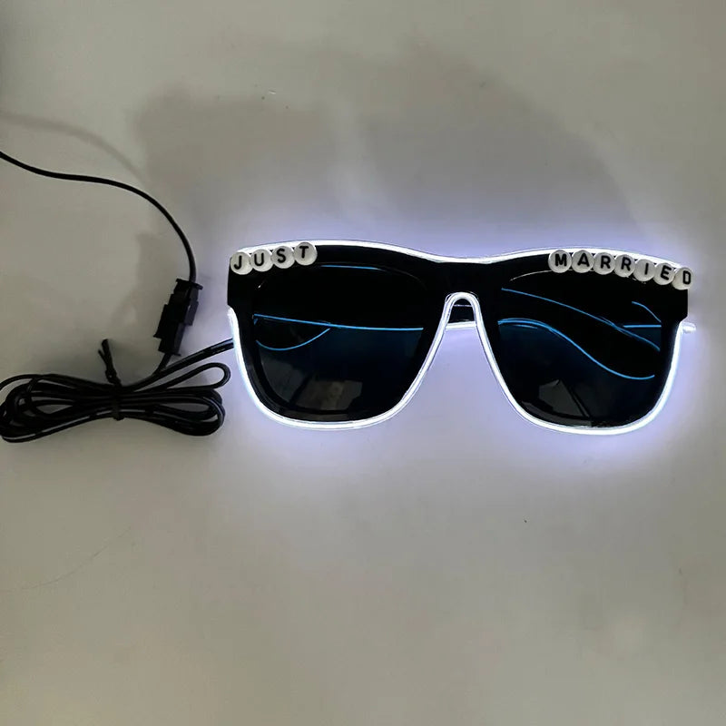 A pair of black sunglasses with blue LED lights around the frame and lenses, connected by an EL wire cable.