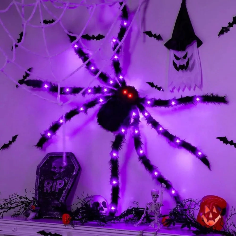 A black LED light-up furry Halloween spider decoration with purple glow on a white wall.