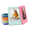 Two magnetic double-sided photo frames, one mint green and one pink, display a woman with a dog.