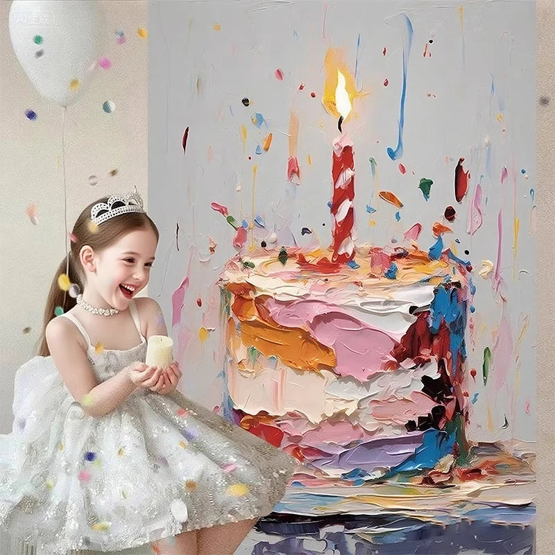 A young girl in a white dress smiles while holding a candle next to a colorful birthday cake on an artistic painted backdrop.