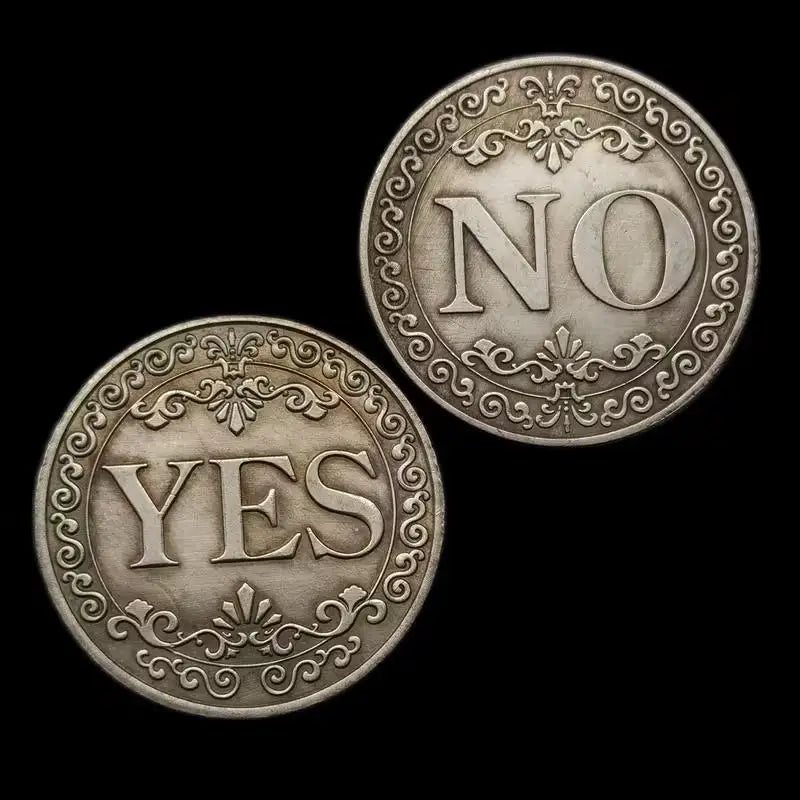 Two antique silver-gray decision coins, one engraved with NO and the other with YES, set against a black background.