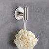 A silver magnetic wall-mounted kitchen storage rack with a narrow edge is shown against a gray wall.