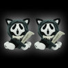 A plush toy resembling a cat face with black and white markings, wearing a hood and holding a knife.