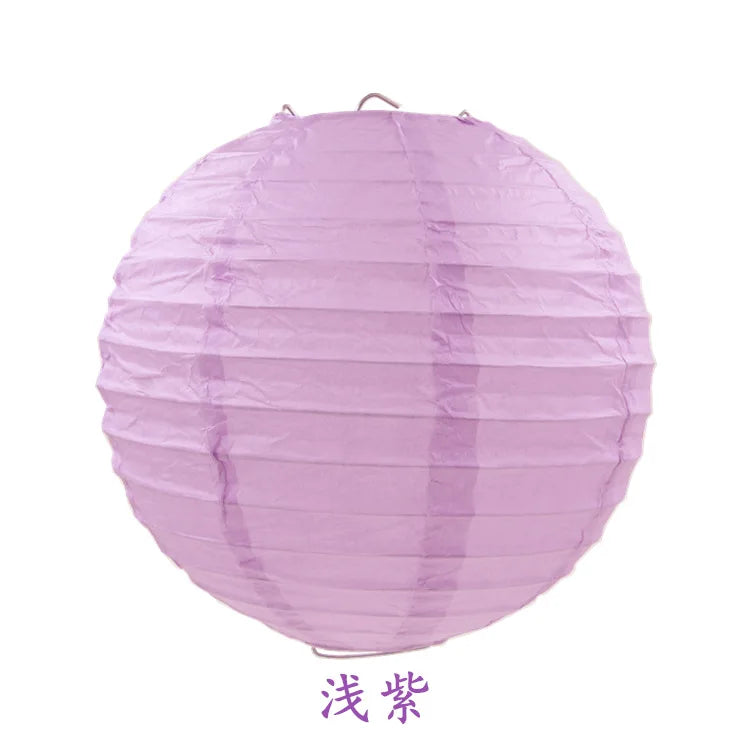 A round, sheer purple paper lantern.