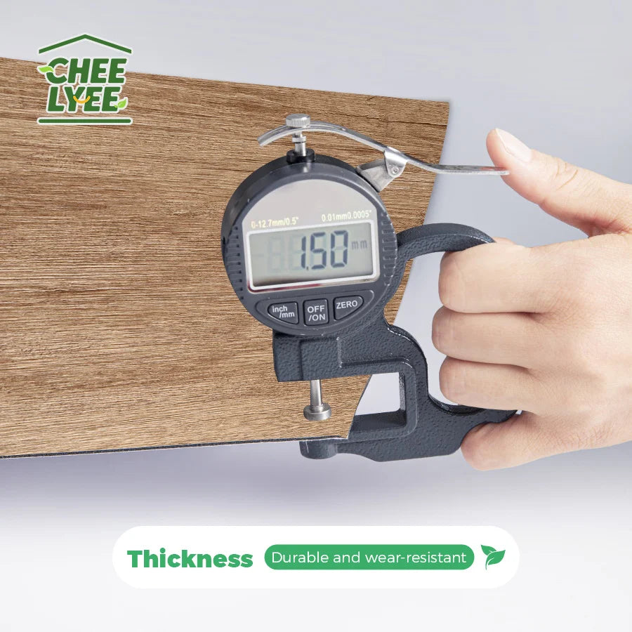 A hand holds a digital thickness gauge measuring the thickness of wood grain wall tiles.