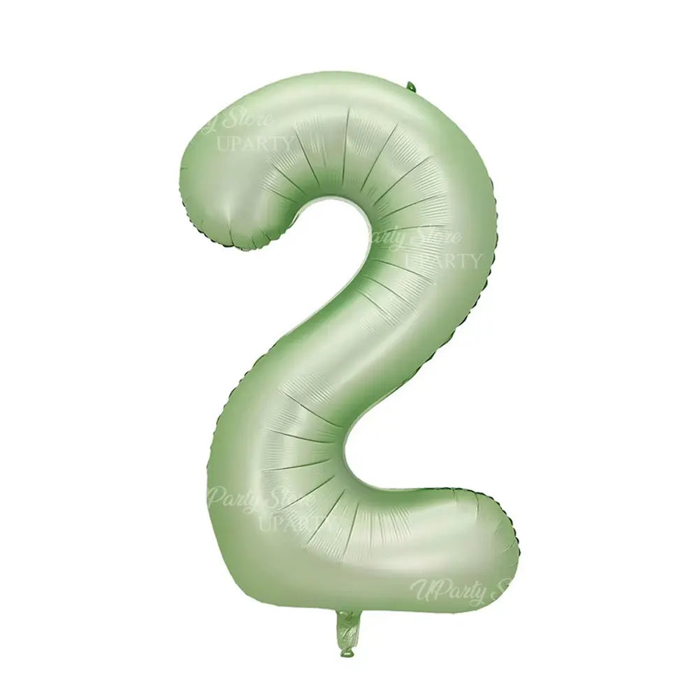 A large, light green foil number balloon shaped like the number 2.
