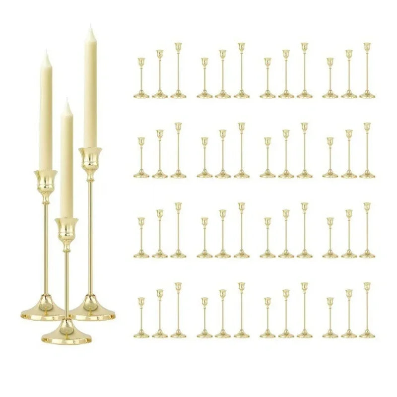 A set of twelve elegant gold-toned metal candle holders for weddings and holiday decor.