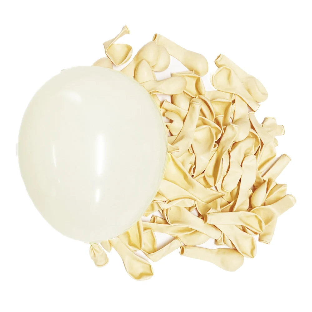 A cluster of gold foil balloons scattered on a white background.