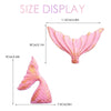 Pink mermaid tail cake topper set featuring a sea star and seashell decoration.