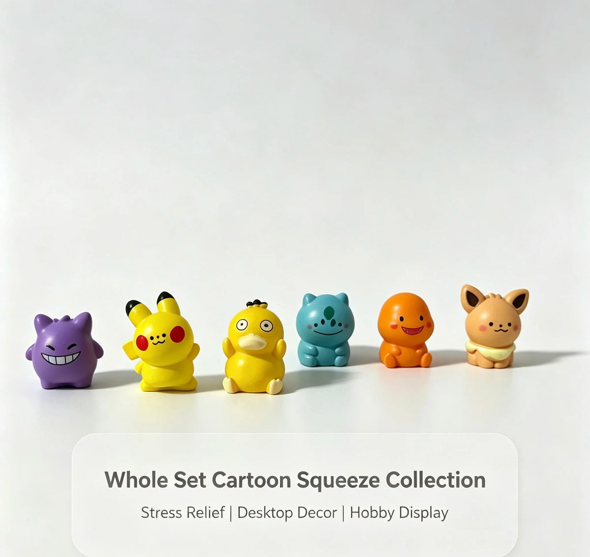 A collection of six colorful cartoon and fantasy creature mini figurines displayed on a white surface.
