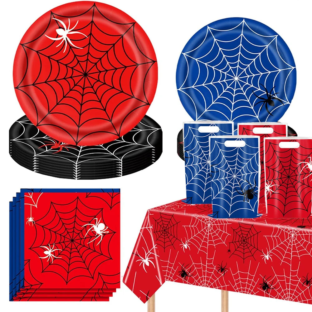 A set of red and blue spider web party supplies including a circular decoration, folded banners, and a table runner.