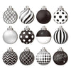 A collection of black and white patterned spherical Christmas ornaments featuring polka dots, stripes, and geometric designs.