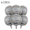 A set of six silver disco ball foil balloons for birthday party decorations