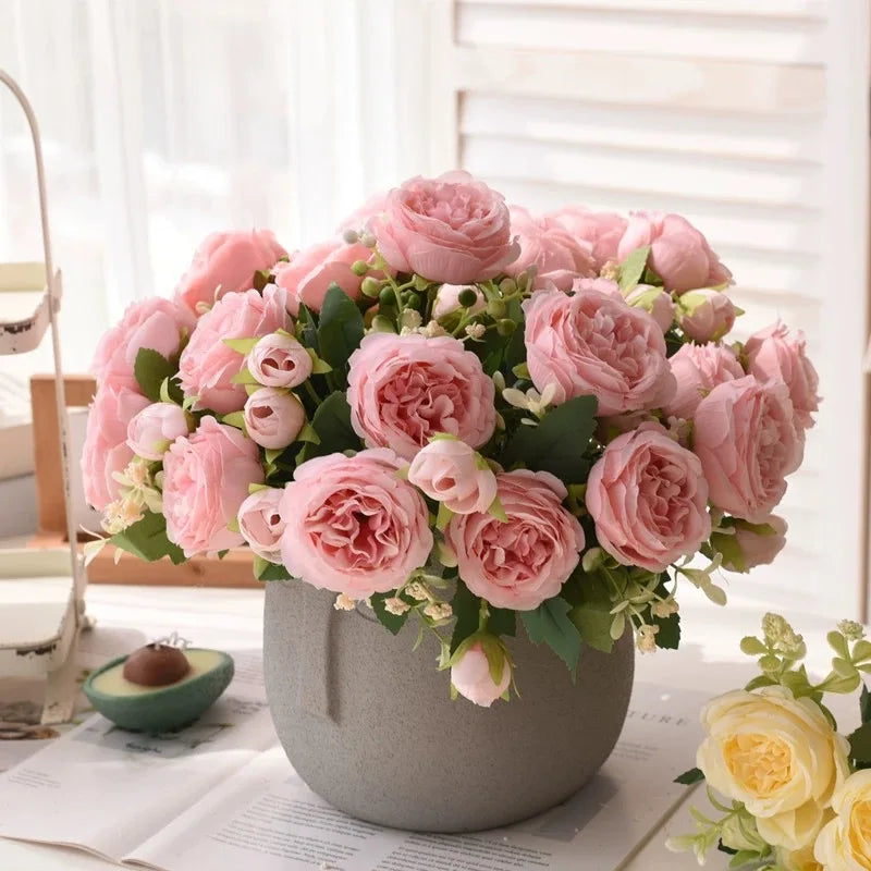 A bouquet of pink silk peony roses in a gray pot, suitable for weddings and home decor.