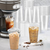 A set of clear plastic disposable cups with lids is shown next to a glass of iced coffee.