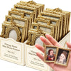 A hand holds a set of gold-colored vintage resin mini photo frames for crafting and display.