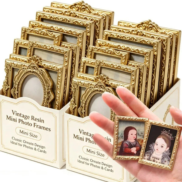 A hand holds a set of gold-colored vintage resin mini photo frames for crafting and display.