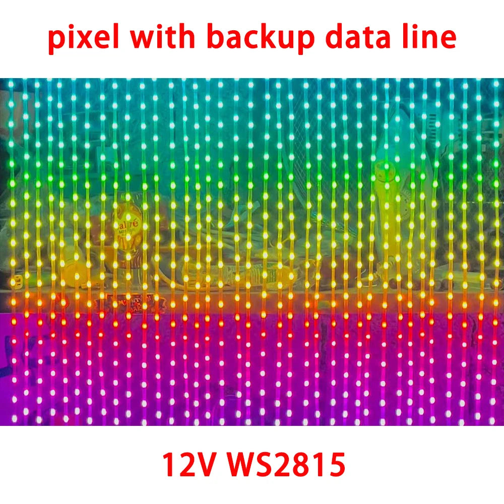 A close-up of a string of pixel LED lights with a backup data line, displaying various colors.