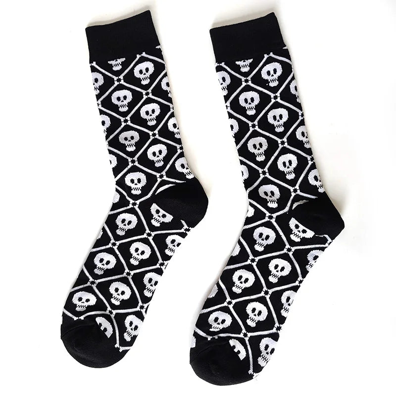 Pair of black novelty crew socks featuring a repeating pattern of white skulls, aliens, and tigers.